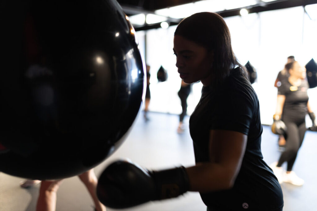 Marcia Swanepoel, a personal trainer at Virgin Active The Sanctuary in Somerset West, guiding clients of diverse skill and fitness levels through an engaging boxing fitness session.