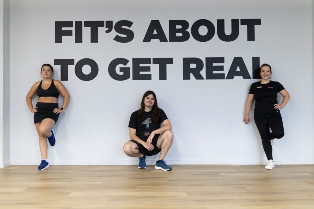 Group of individuals posing in the gym at Virgin Active The Sanctuary, Cape Town, part of Marcia Swanepoel’s training program.