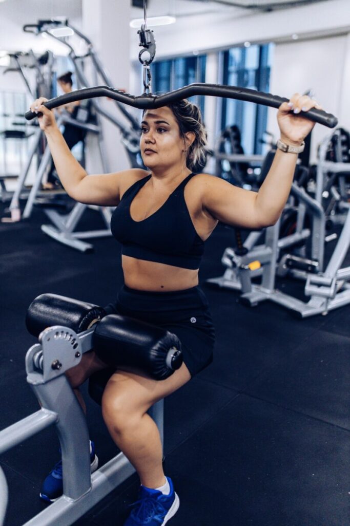 Client performing a strength training exercise at Virgin Active The Sanctuary, Somerset West, under Marcia Swanepoel’s guidance.